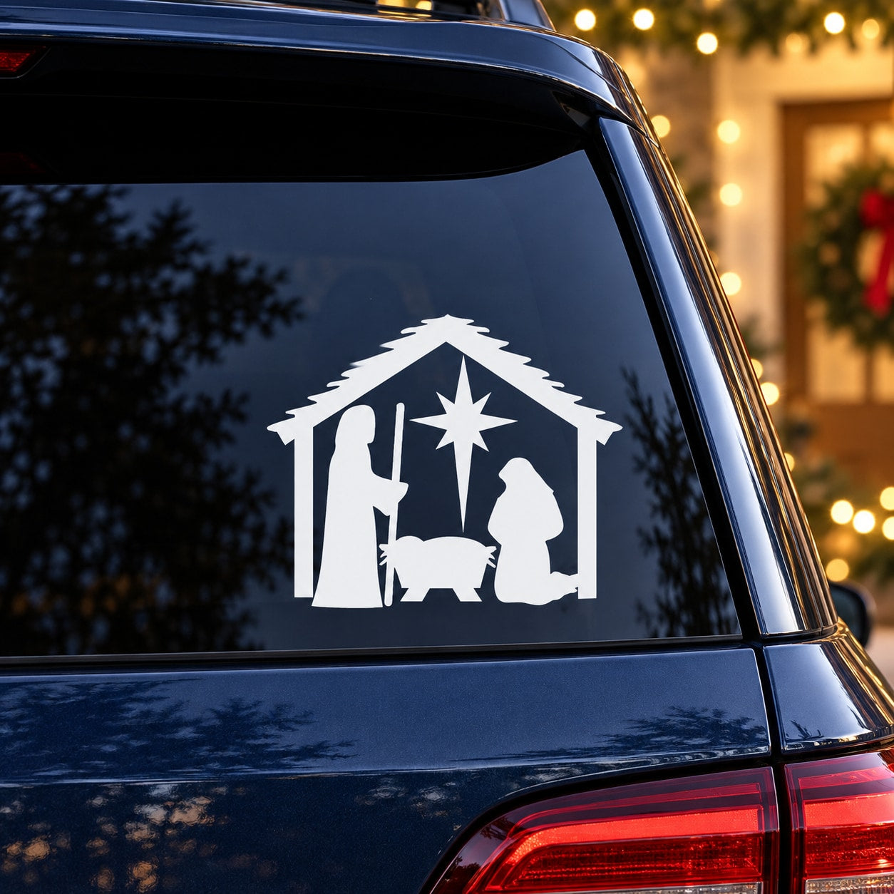 White nativity scene car decal with star over manger silhouette