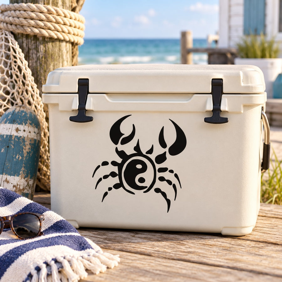 Black yin-yang crab decal with swirl eye, shown on a cooler
