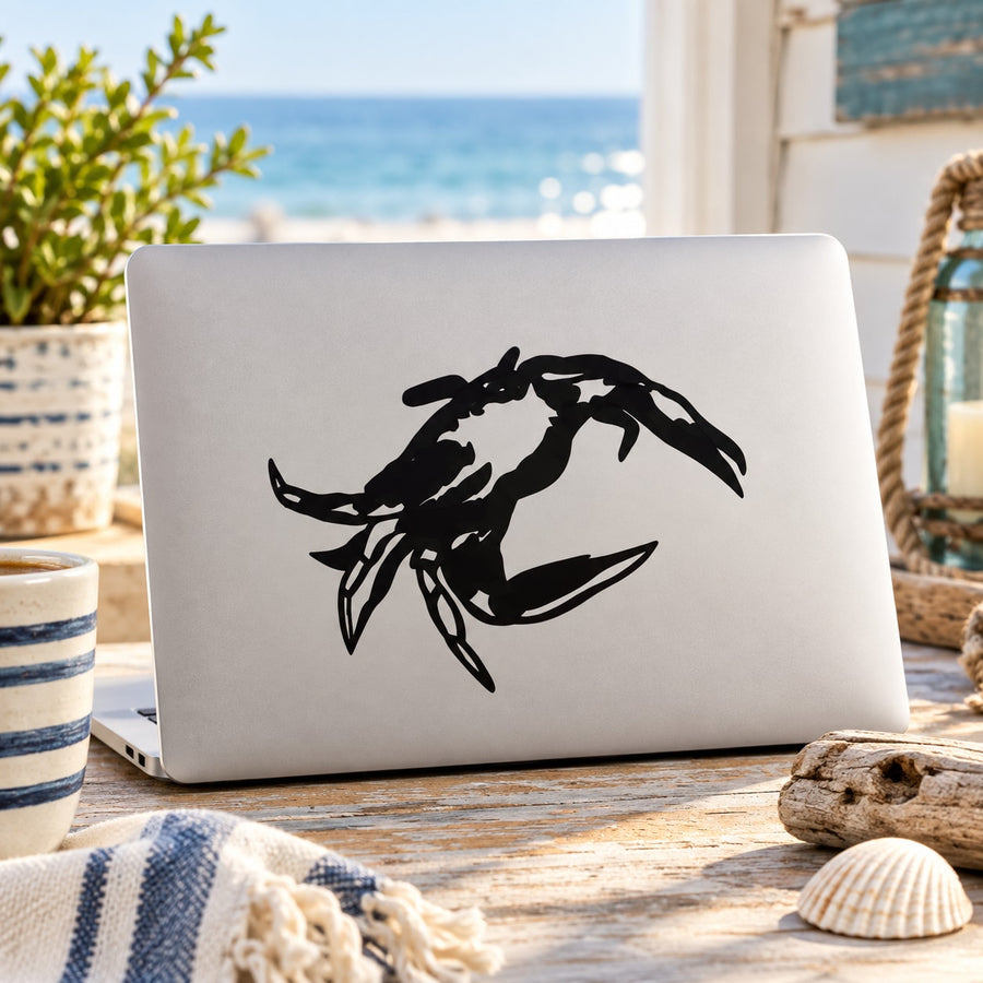 Black beach crab decal sticker on a laptop lid