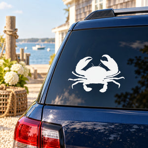 White ocean crab decal on dark blue car window