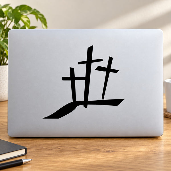 Triple cross decal with black symbol on light surface