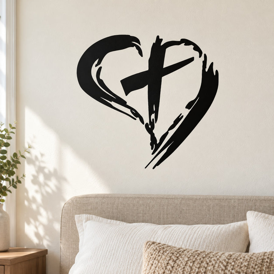 Black cross in a heart wall decal with bold brushstroke style
