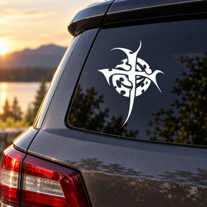 Dark car rear window with white thorned cross and spiral decal