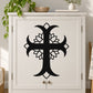 Black cross decal with layered flower petals, centered on a white cabinet door