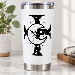 Stainless steel tumbler with white body and black decal featuring cross, moon, and fish