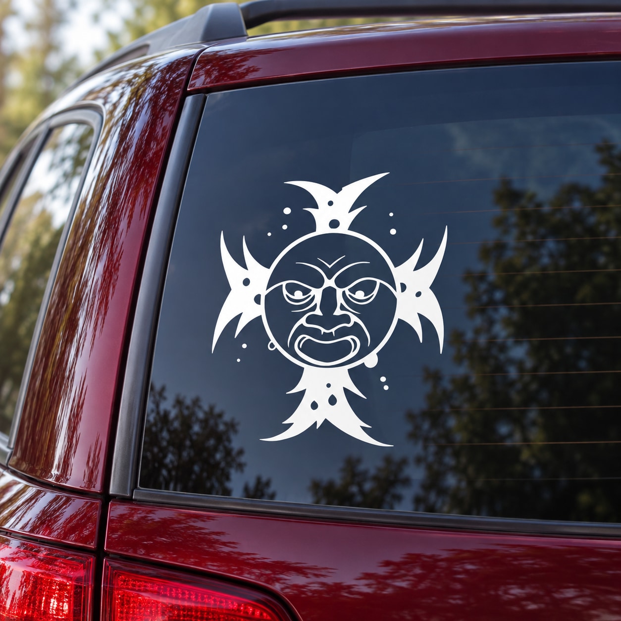 White angry sun and face decal on car rear window glass