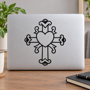 Decorative cross decal with center heart, black outline on light surface