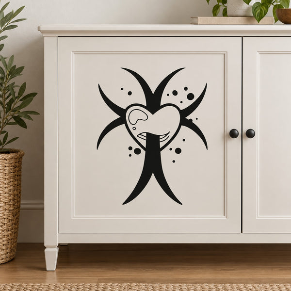 Black cross decal with pierced heart and dots, white backing