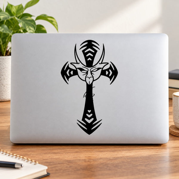 Laptop with black demon mask cross decal graphic