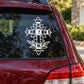 Decorative flower cross decal: white floral cross with leaf accents on car window