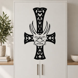 Black filigree cross wall decal with demon mask and hanging charm details