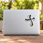 Wiggly cross decal, black wavy cross graphic sticker on light surface