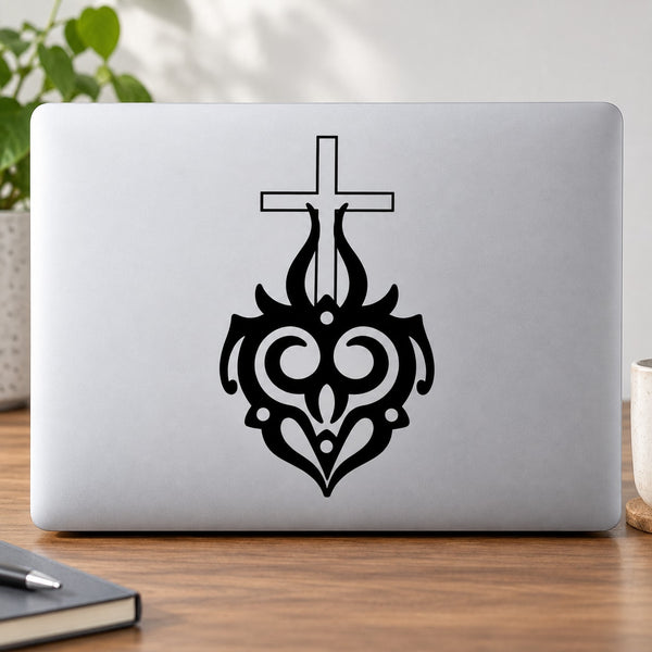 Black cross with tribal flames decal design on a light laptop lid