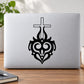 Black cross with tribal flames decal design on a light laptop lid