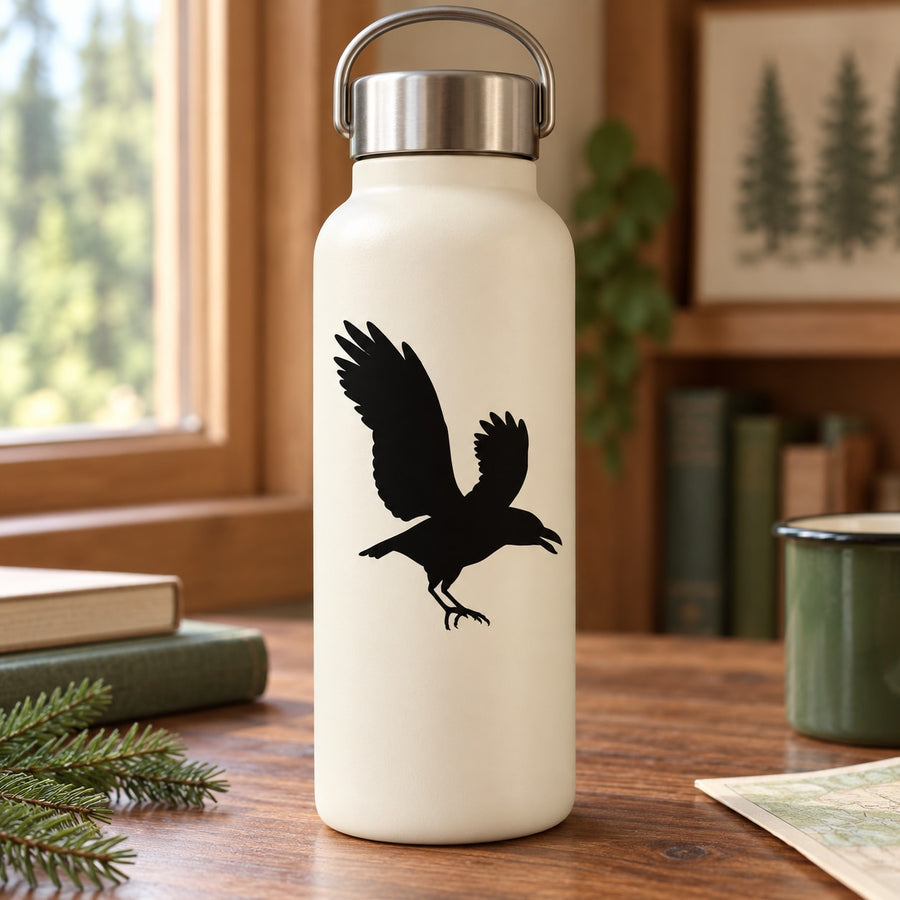 White bottle with black flapping raven silhouette decal