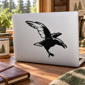 Black crow landing decal sticker with bird silhouette on a light surface