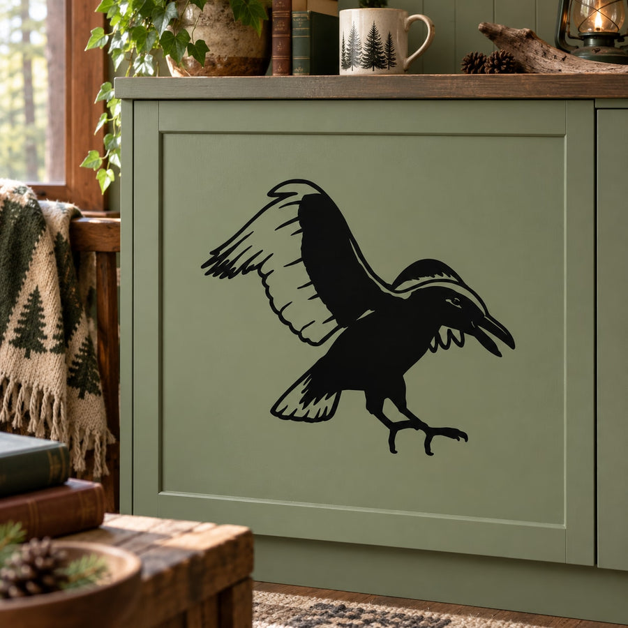 Black raven silhouette decal with wings spread