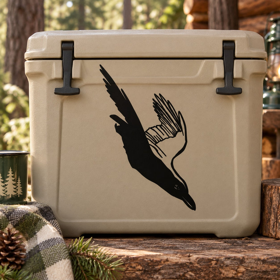 Swooping crow decal, black silhouette on light cooler lid