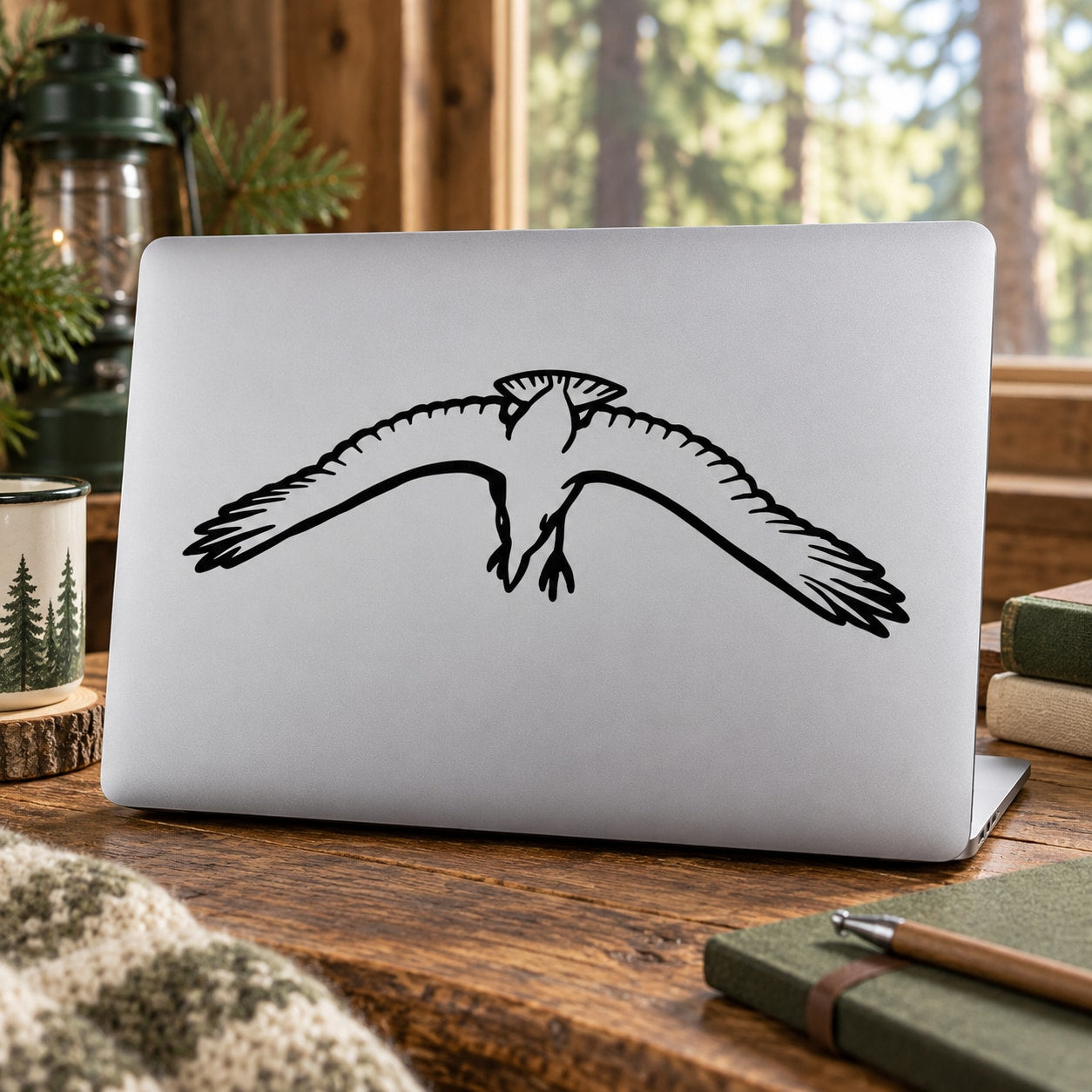 Drifting crow graphic decal with black bird wings spread on light surface