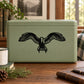 Raven decal with spread wings, black graphic on green storage box