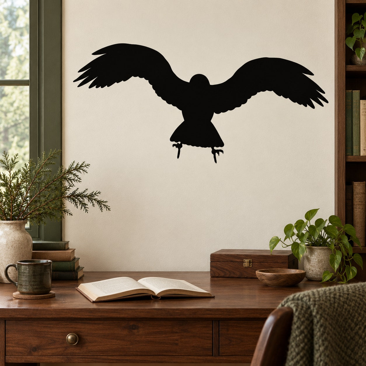 Black raven silhouette decal with wings spread