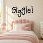 Black "Giggle!" wall decal with playful lettering