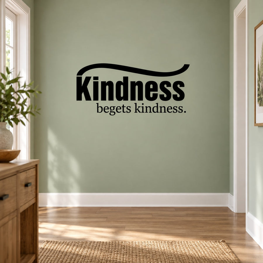 Black wall decal with large text "Kindness" and "begets kindness." underlined