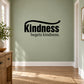Black wall decal with large text "Kindness" and "begets kindness." underlined