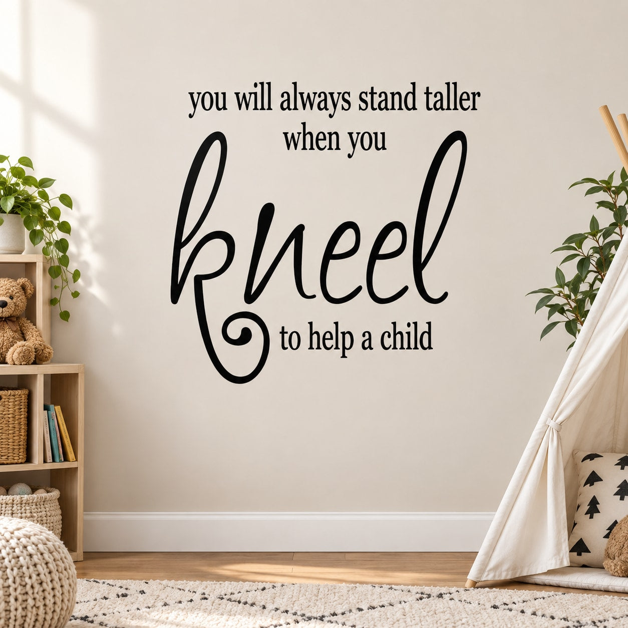Black wall decal with handwritten quote: “kneel when you help a child.”