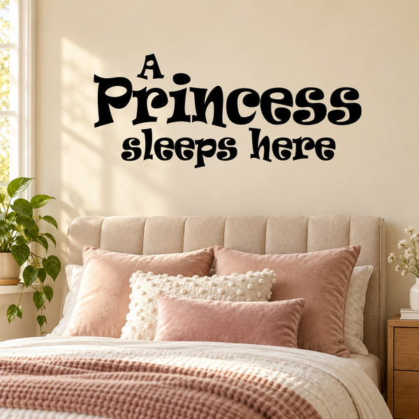 Black wall decal text: A Princess sleeps here, whimsical script.