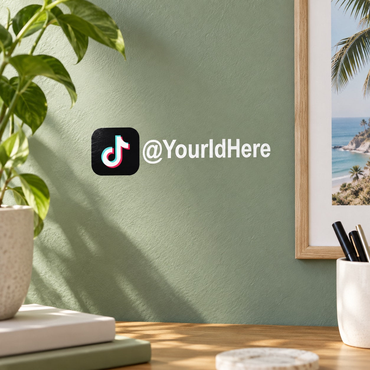 Die-cut TikTok decal with logo and @YourIdHere handle on a green wall