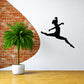 Prancing dancer wall decal, black silhouette of a dancing figure mid-leap