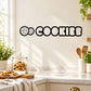 Black cookies wall decal with word “COOKIES” and cookie icon dots