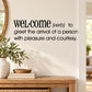 Welcome wall decal with text: verb to greet the arrival of a person