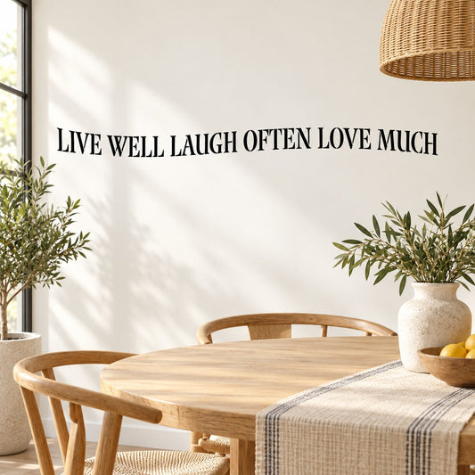 Wall decal lettering: “LIVE WELL LAUGH OFTEN LOVE MUCH” with leafy accents