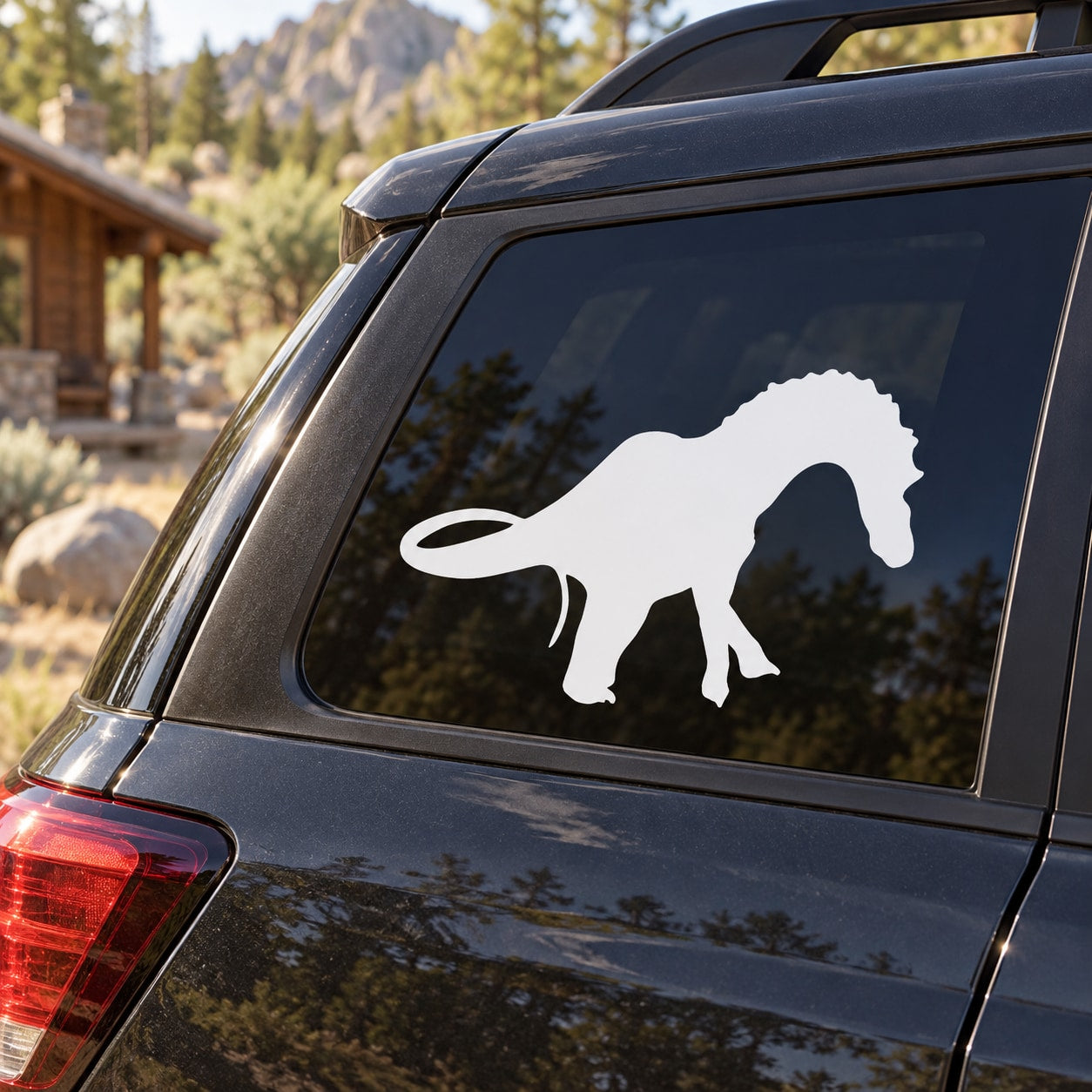 White Dicraeosaurus dinosaur decal on car window, rear side view