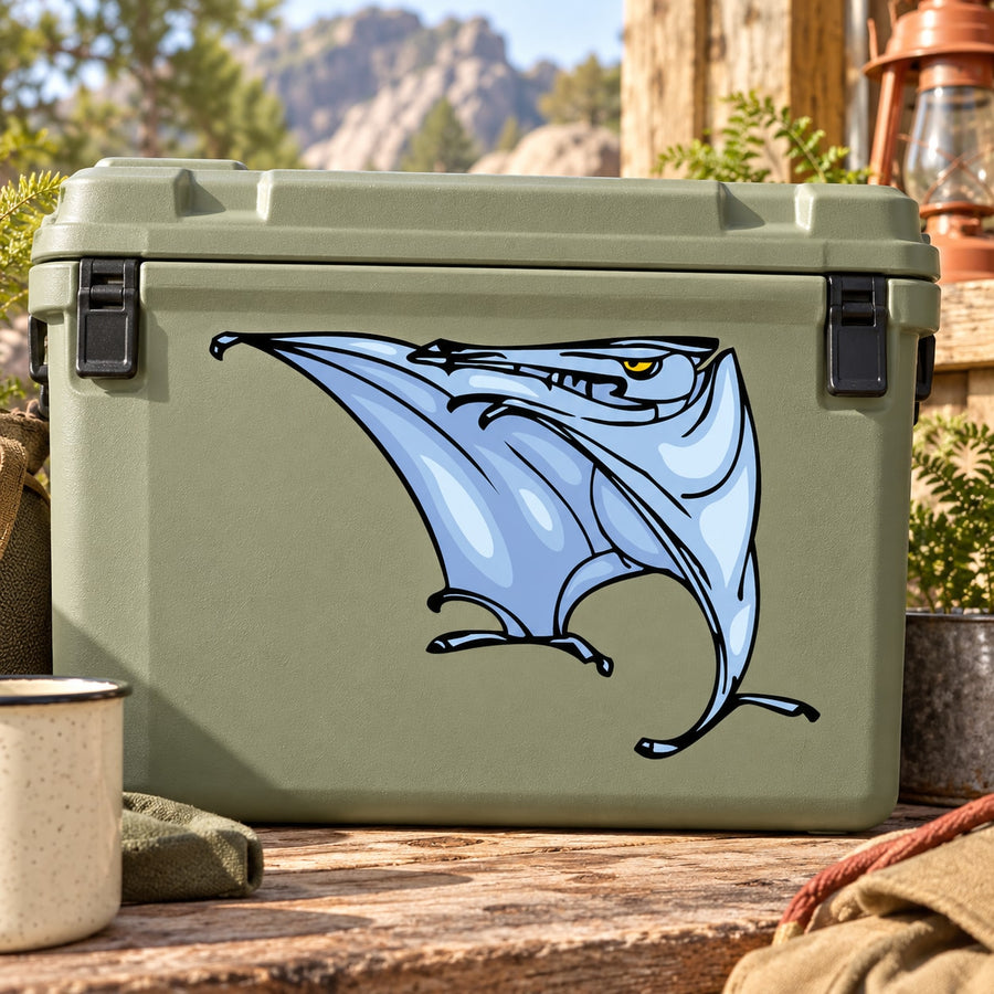 Blue pterasaur dinosaur sticker with wings, on green surface