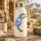 Dinosaur sticker on cream water bottle with stainless steel lid