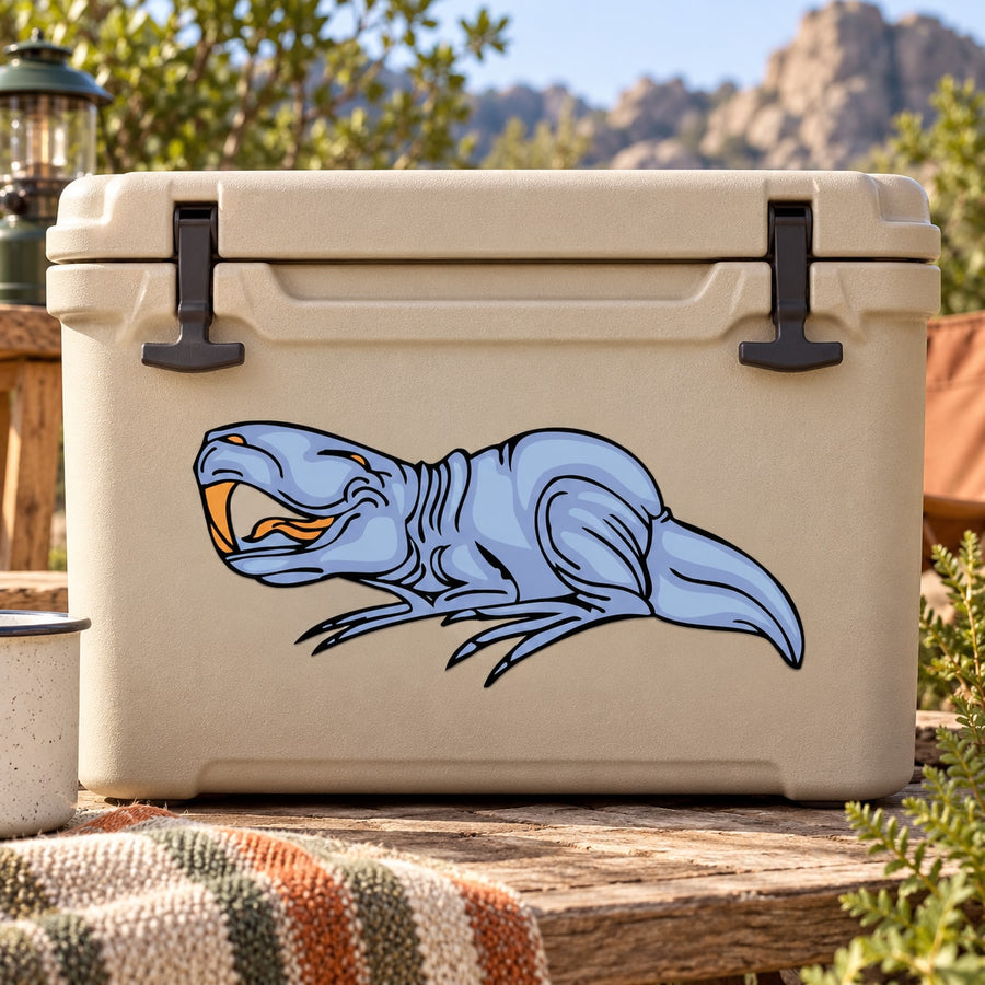Pristerognathus sticker with blue cartoon animal graphic on a tan cooler