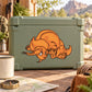Charging triceratops cartoon sticker on green storage container