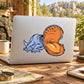 Cartoon dinosaur sticker with orange head and open mouth showing teeth