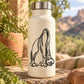 Drinking diplodocus decal sticker with black line-art on cream bottle