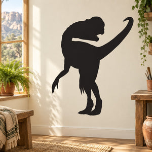 Dinosaur silhouette wall decal of a dinosaur looking back, black