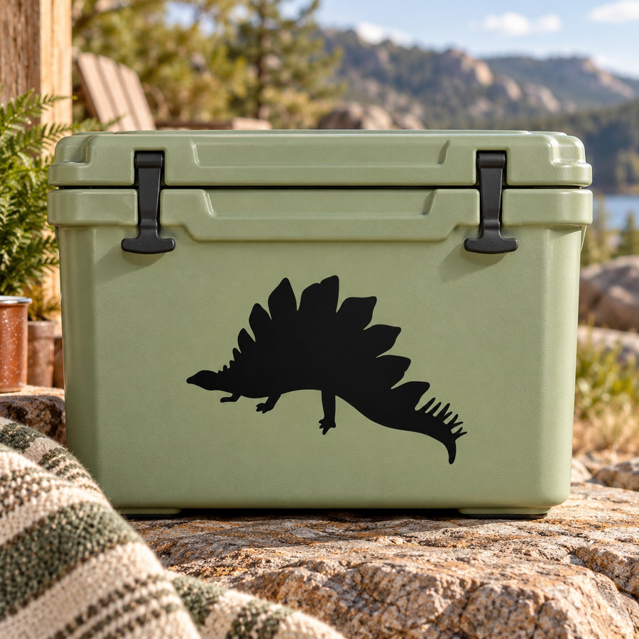 Basking stegosaurus decal, black dinosaur silhouette on light green surface