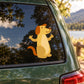 Yellow dog thumbs-up sticker decal on a vehicle window