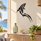 Black razor-style dolphin tattoo decal silhouette on a wall