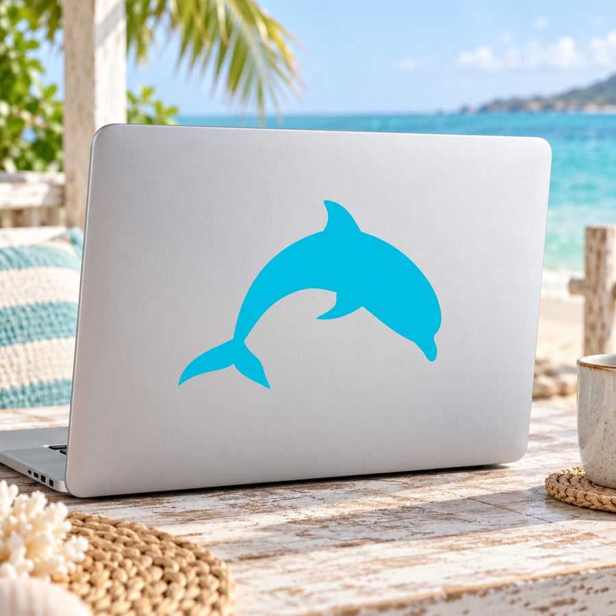 Blue dolphin sticker decal on light-colored laptop lid