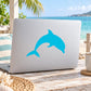 Blue dolphin sticker decal on light-colored laptop lid