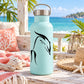 Black dolphin decal graphic on light turquoise bottle