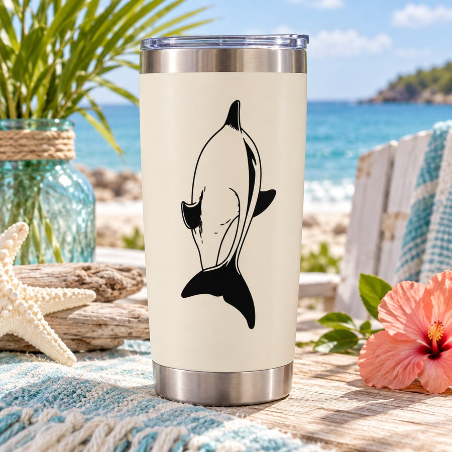 Stainless steel tumbler with dolphin decal on white background